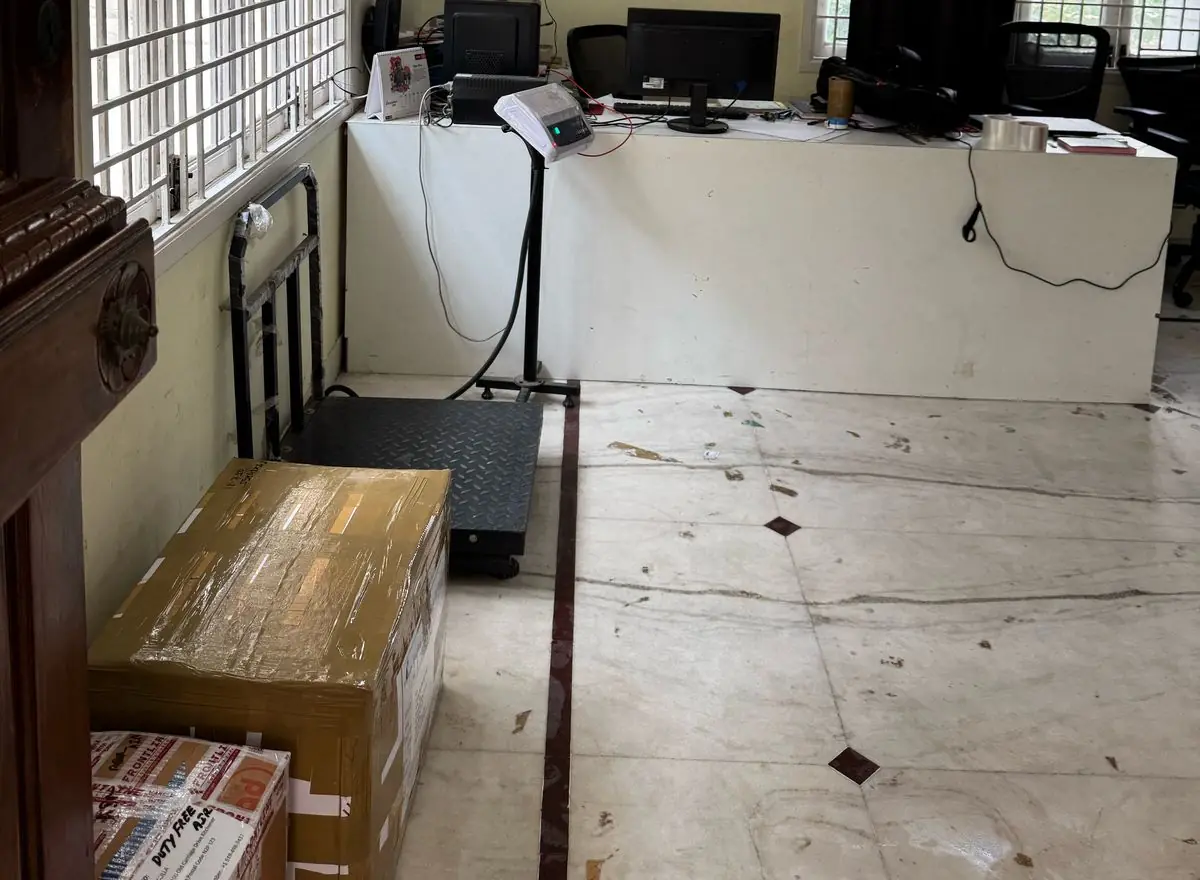 ECS Logistics office counter with weighing scale and a packed box